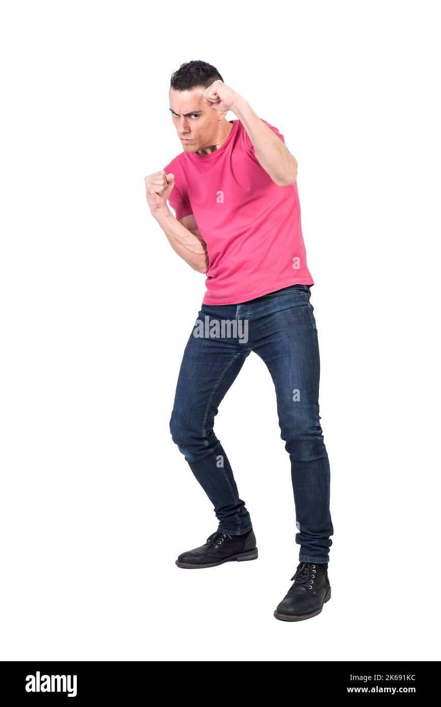 Confident young guy fighting in white studio Stock Photo