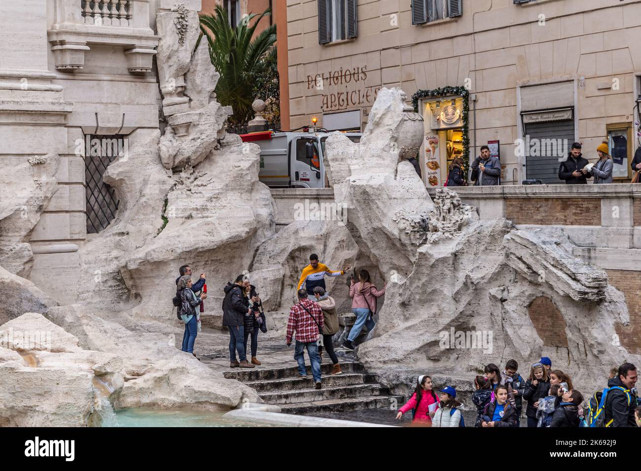 ROME, ITALY - DECEMBER 02, 2019:  Tourists visiting the Trevi Fountain  (Fontana di Trevi) in  Rome, Italy Stock Photo