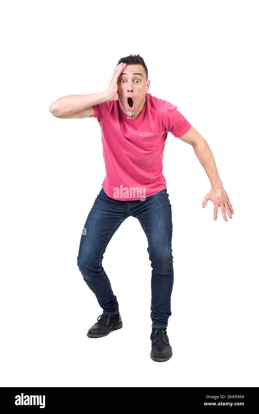 Shocked man standing in studio. White background Stock Photo
