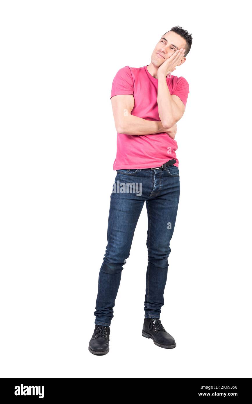 Dreamy man touching cheek in studio. White background Stock Photo