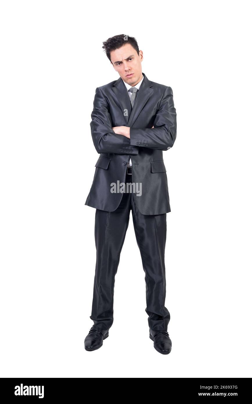 Bored elegant businessman with folded arms looking at camera Stock Photo