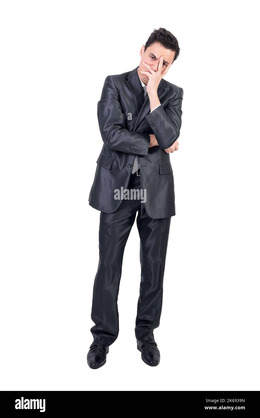 Thoughtful businessman doing facepalm gesture in studio Stock Photo