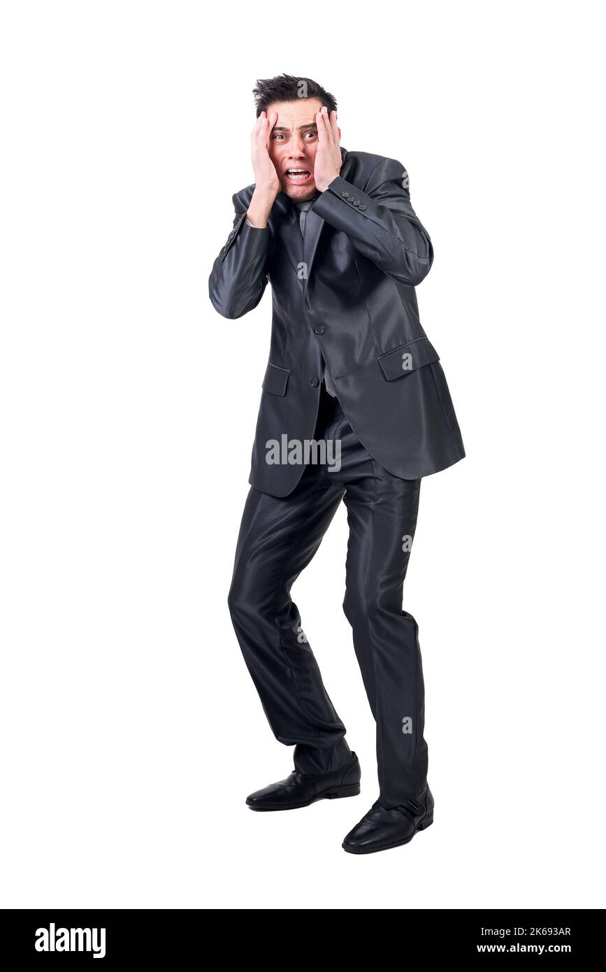 Fearful man in formal suit. White background. Stock Photo