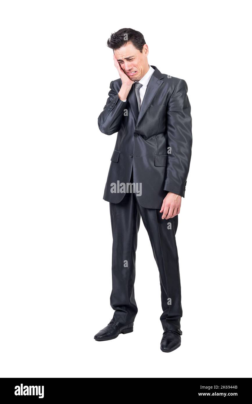 Funny businessman crying against white background. White background. Stock Photo