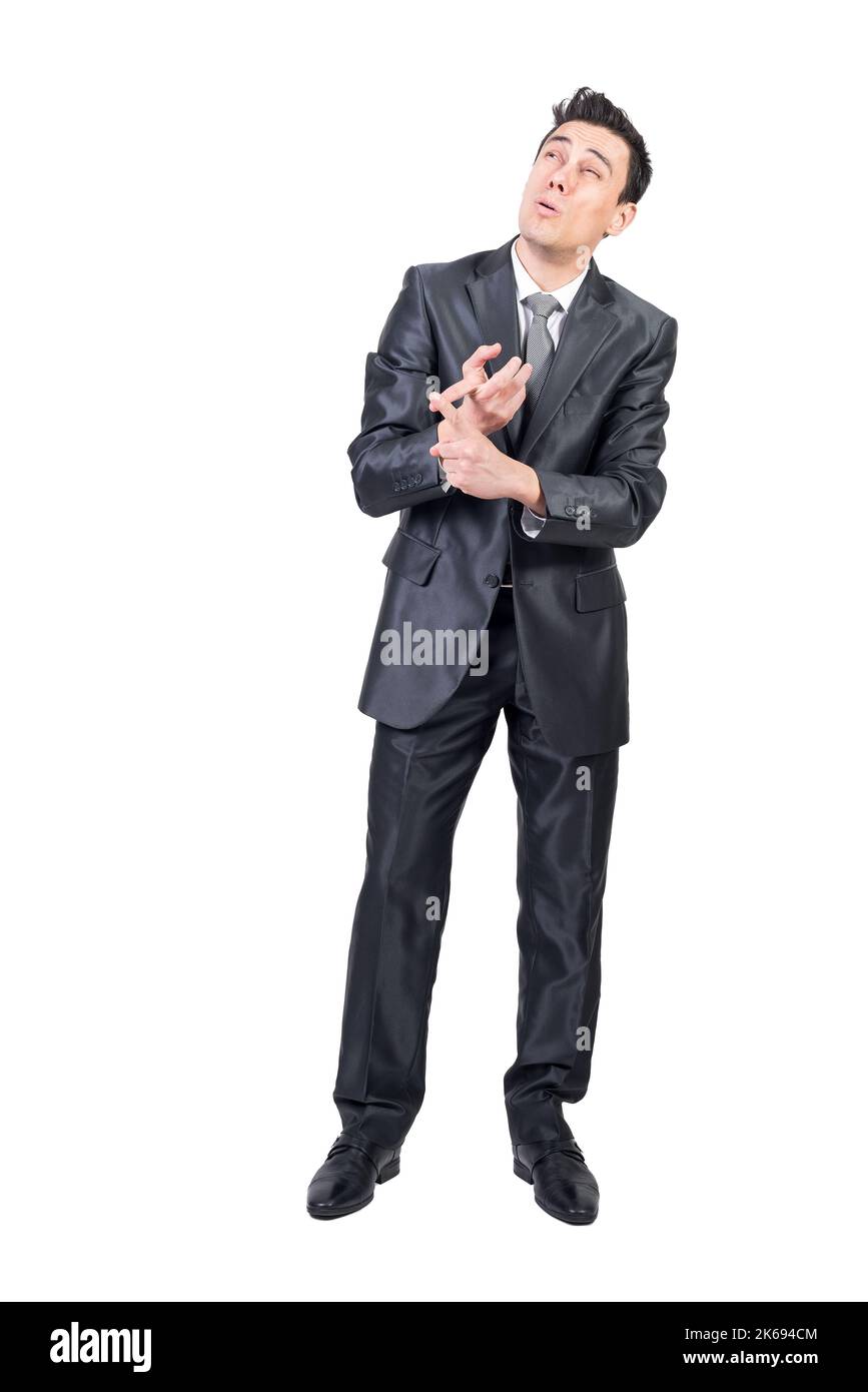 Businessman counting on fingers in studio. White background. Stock Photo