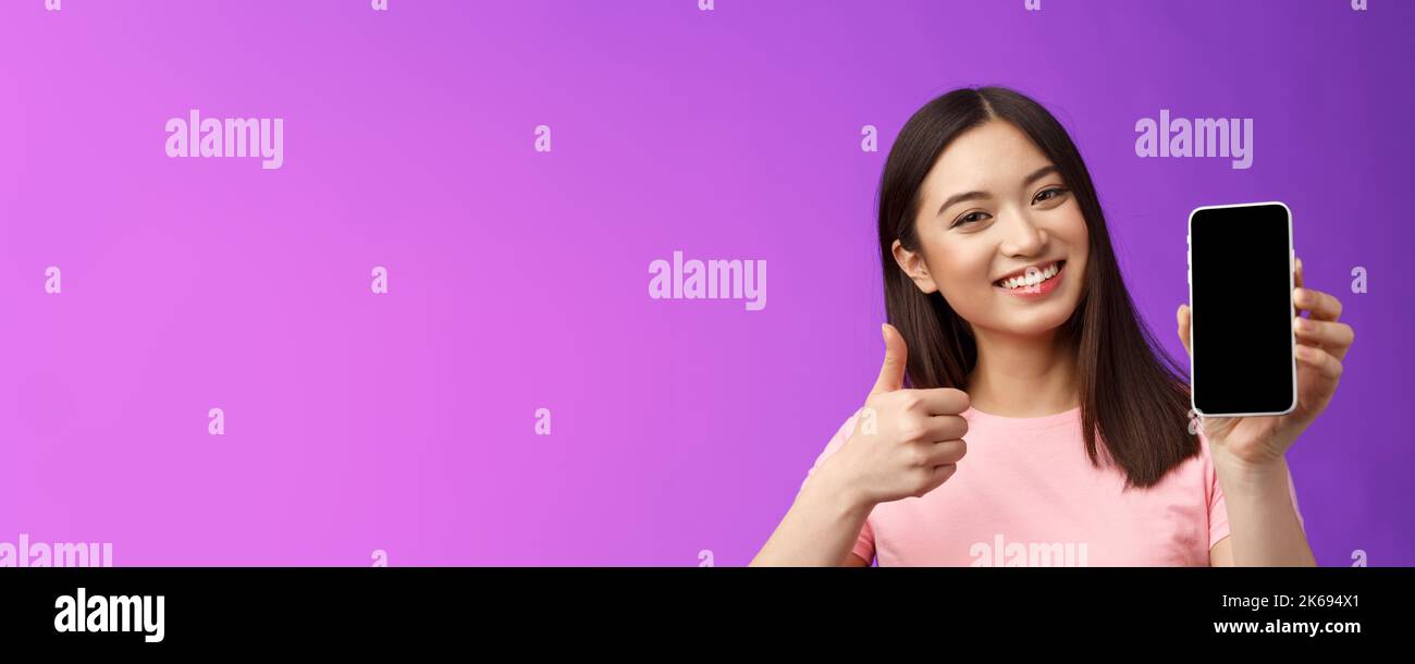 Close-up satisfied happy attractive modern asian woman give positive ...