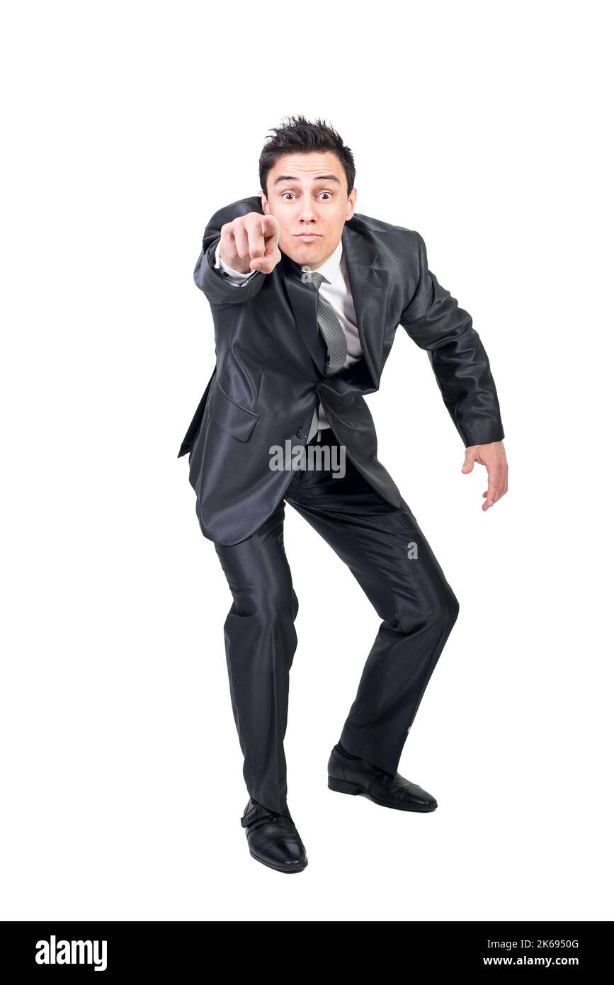 Man in suit pointing at camera. White background. Stock Photo