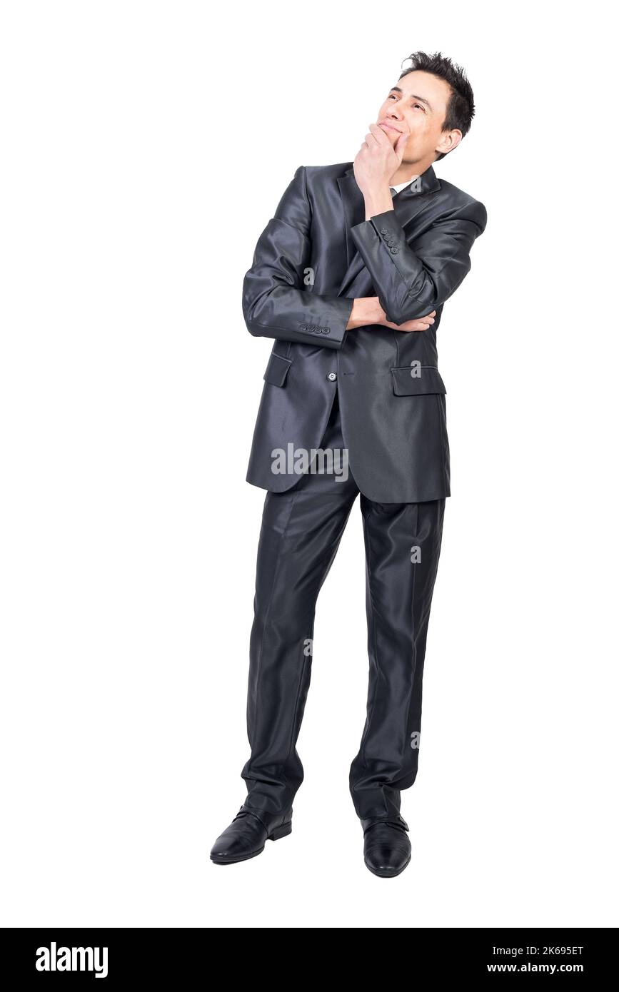 Dreamy businessman touching chin and thinking in studio Stock Photo