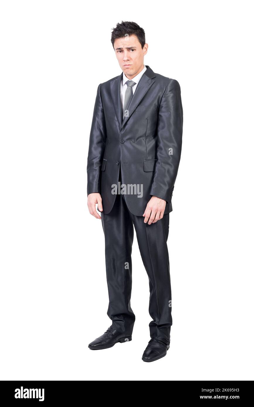 Upset young man in classy suit looking at camera Stock Photo