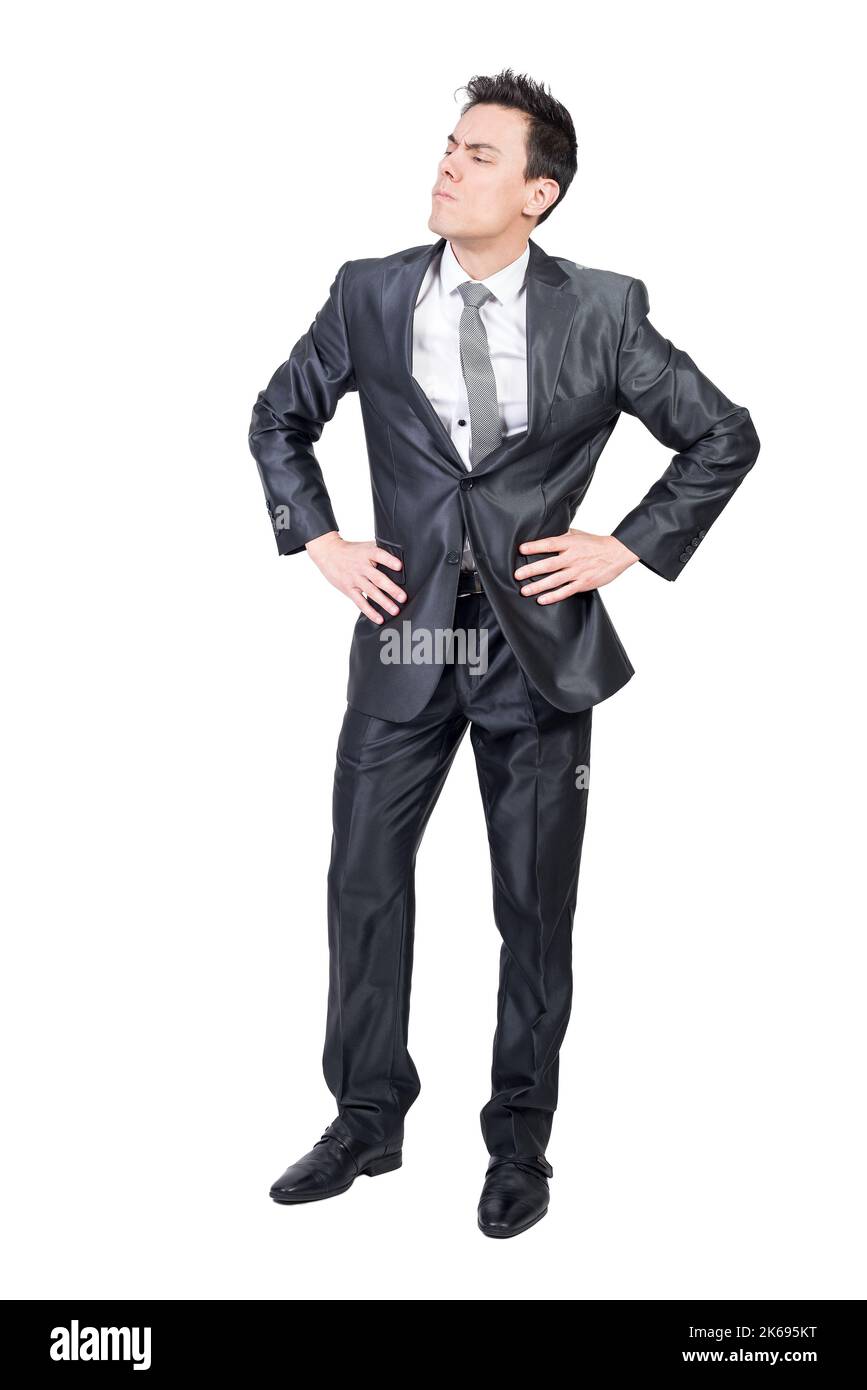 Attentive male manager looking away standing in studio Stock Photo