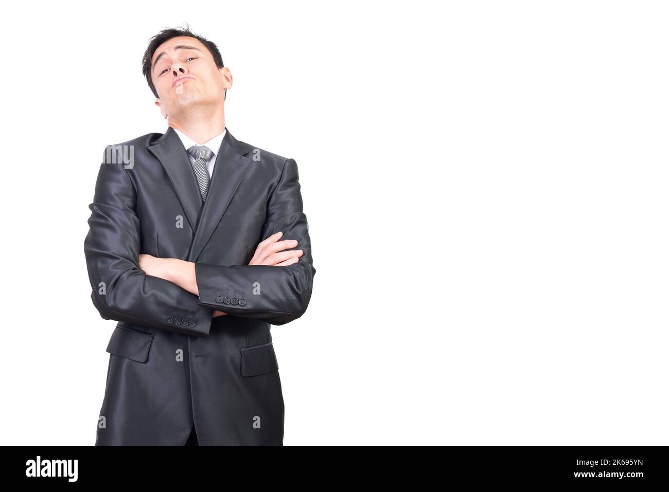 Self assured businessman with folded arms looking at camera Stock Photo