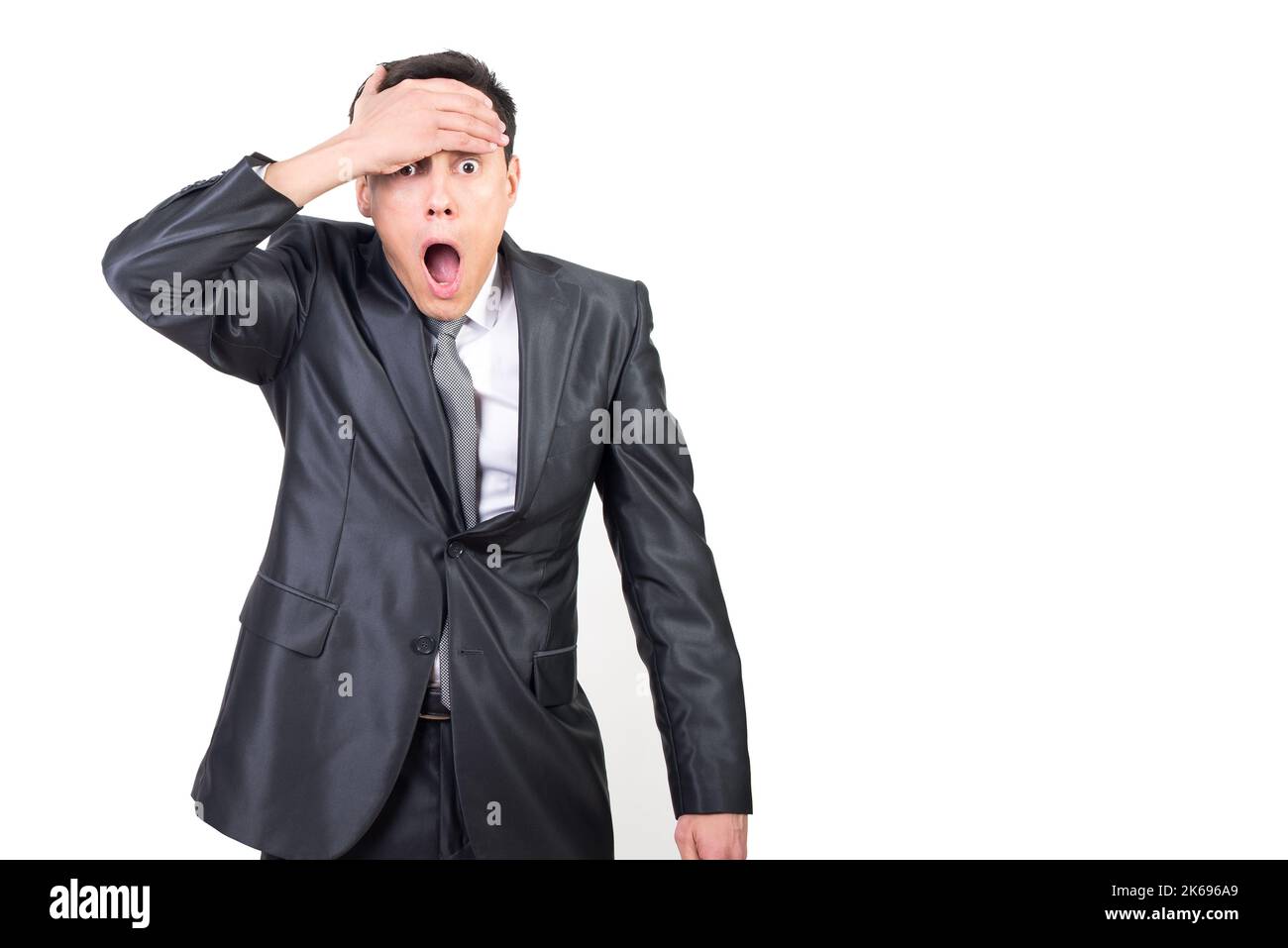 Shocked male in elegant suit hi-res stock photography and images - Alamy