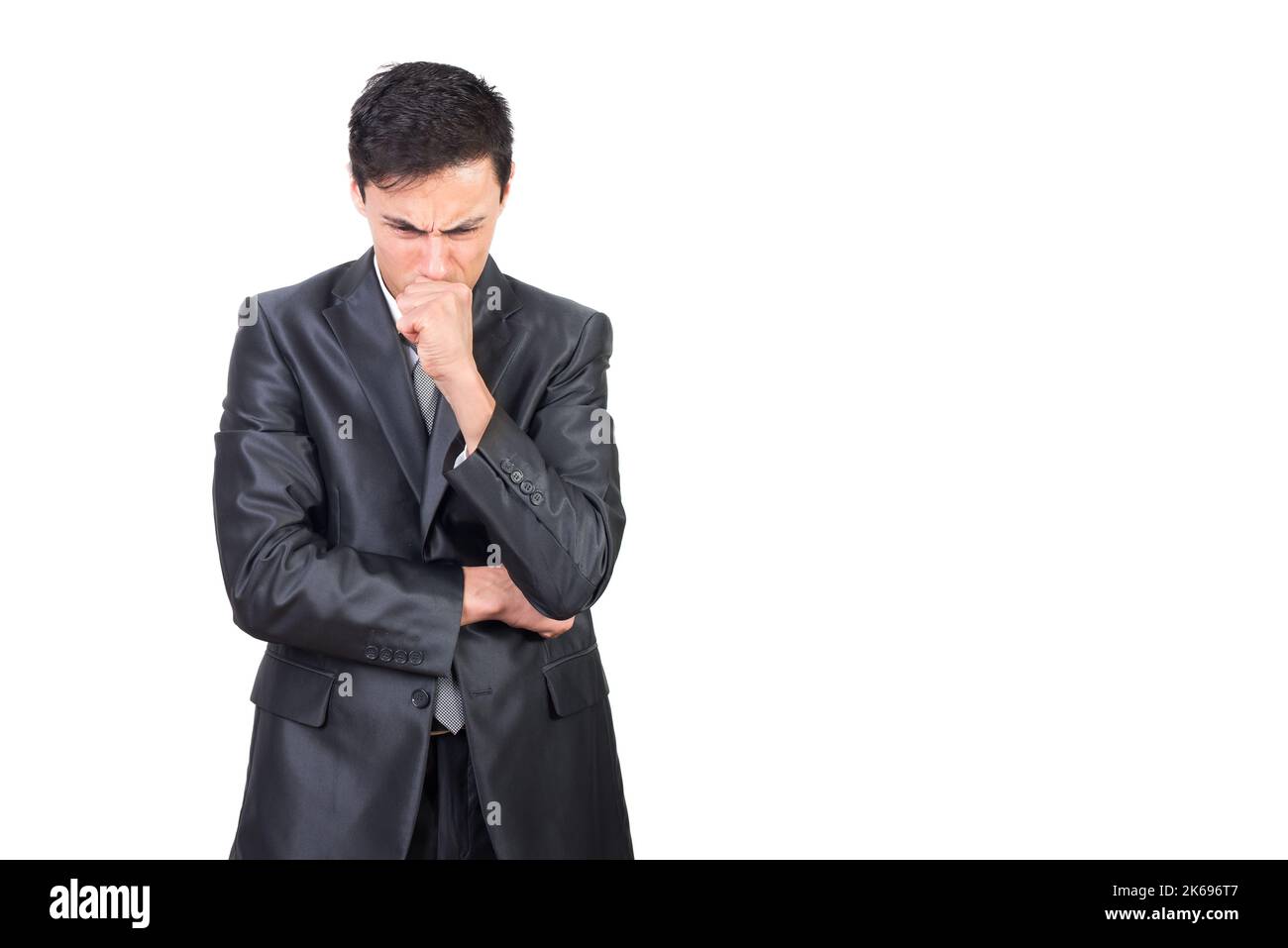 Focused worried man touching chin and thinking Stock Photo