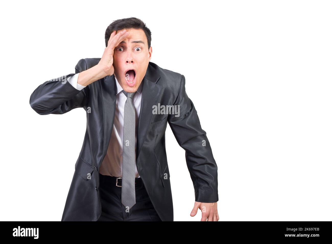Surprised man in suit looking at camera Stock Photo
