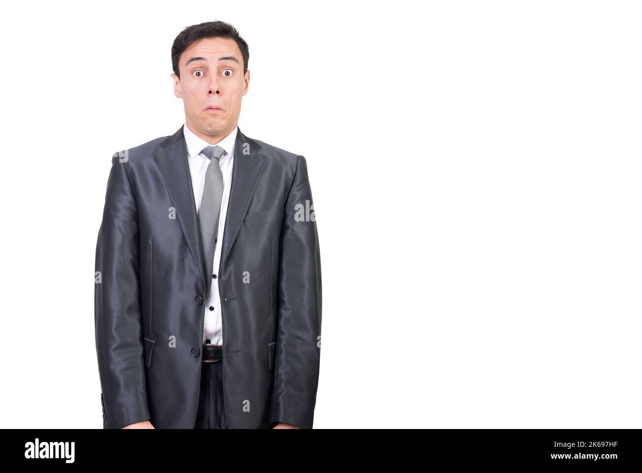 Shocked man in suit looking at camera Stock Photo