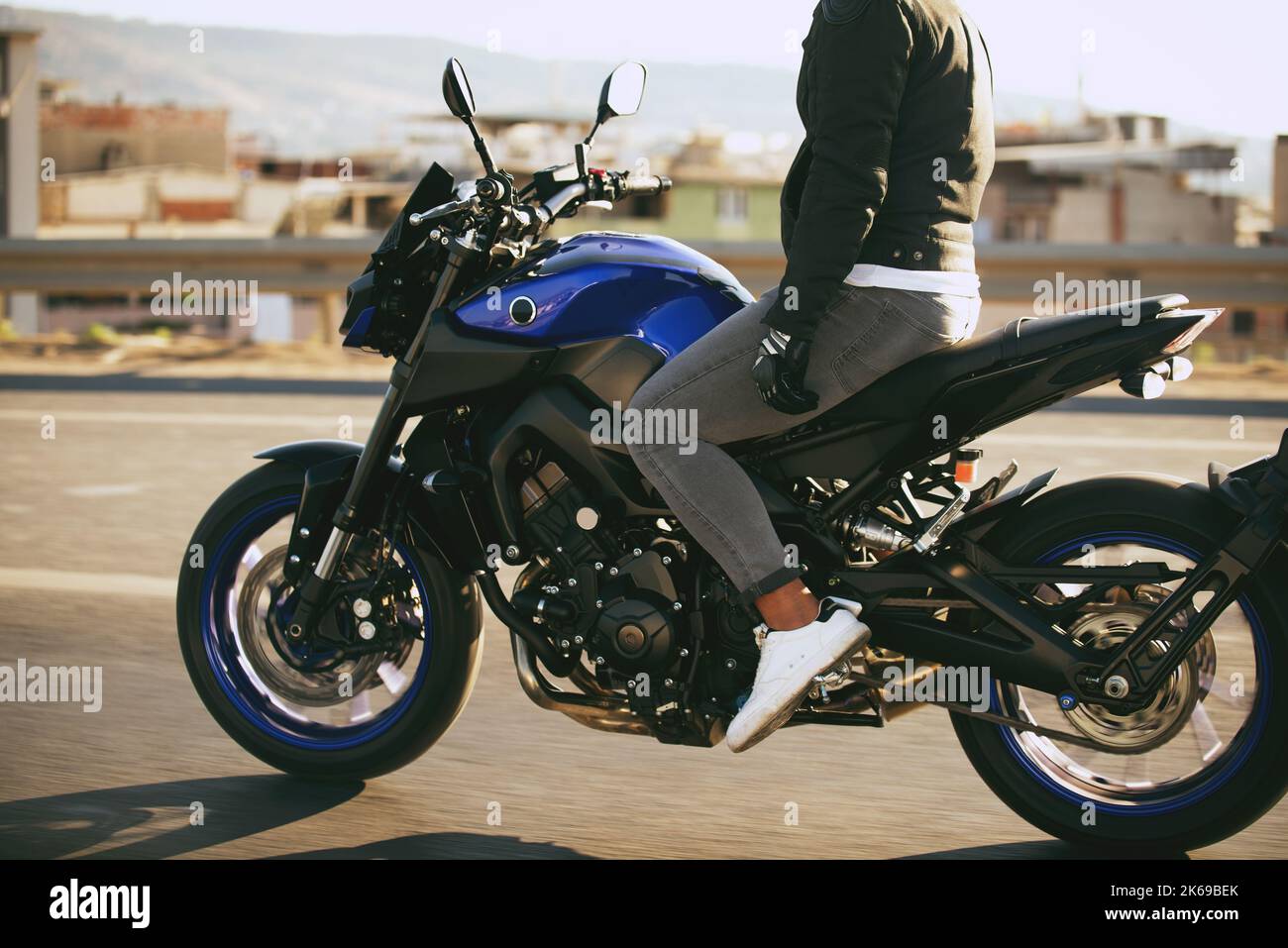 Man riding a supersport motorcycle with no hands on highway Stock Photo Alamy