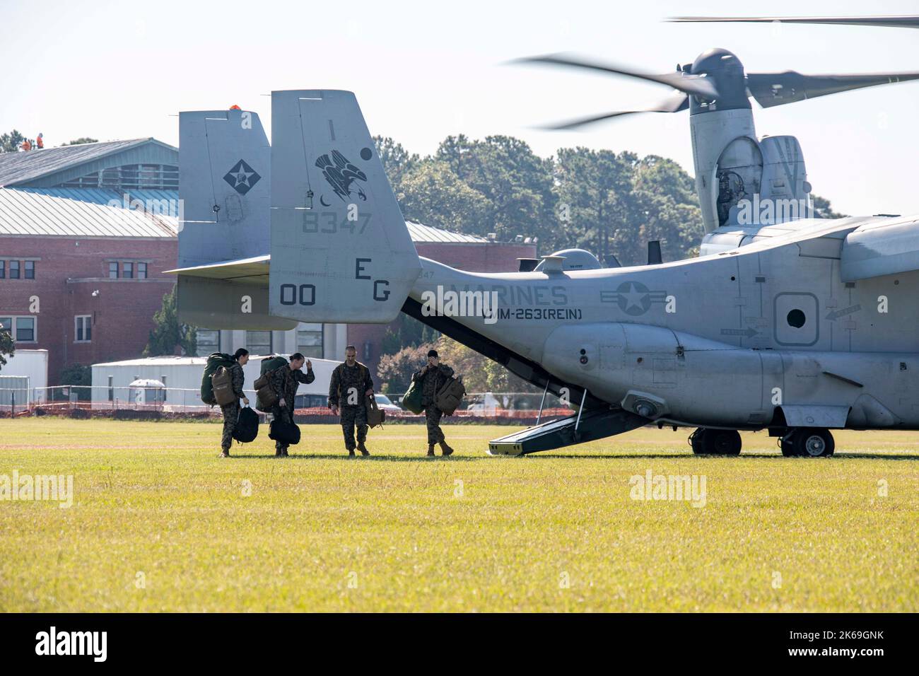 U.S. Marines assigned to the Command Element, 22nd Marine Expeditionary Unit (MEU), exit an MV-22 Osprey aboard Marine Corps Base Camp Lejeune, North Carolina, Oct. 11, 2022. Marines and Sailors assigned to the 22nd MEU returned home after completing a seven-month deployment with the Kearsarge Amphibious Ready Group in the U.S. Naval Sixth Fleet area of operations. (U.S. Marine Corps photo by Sgt. Mason Roy) Stock Photo