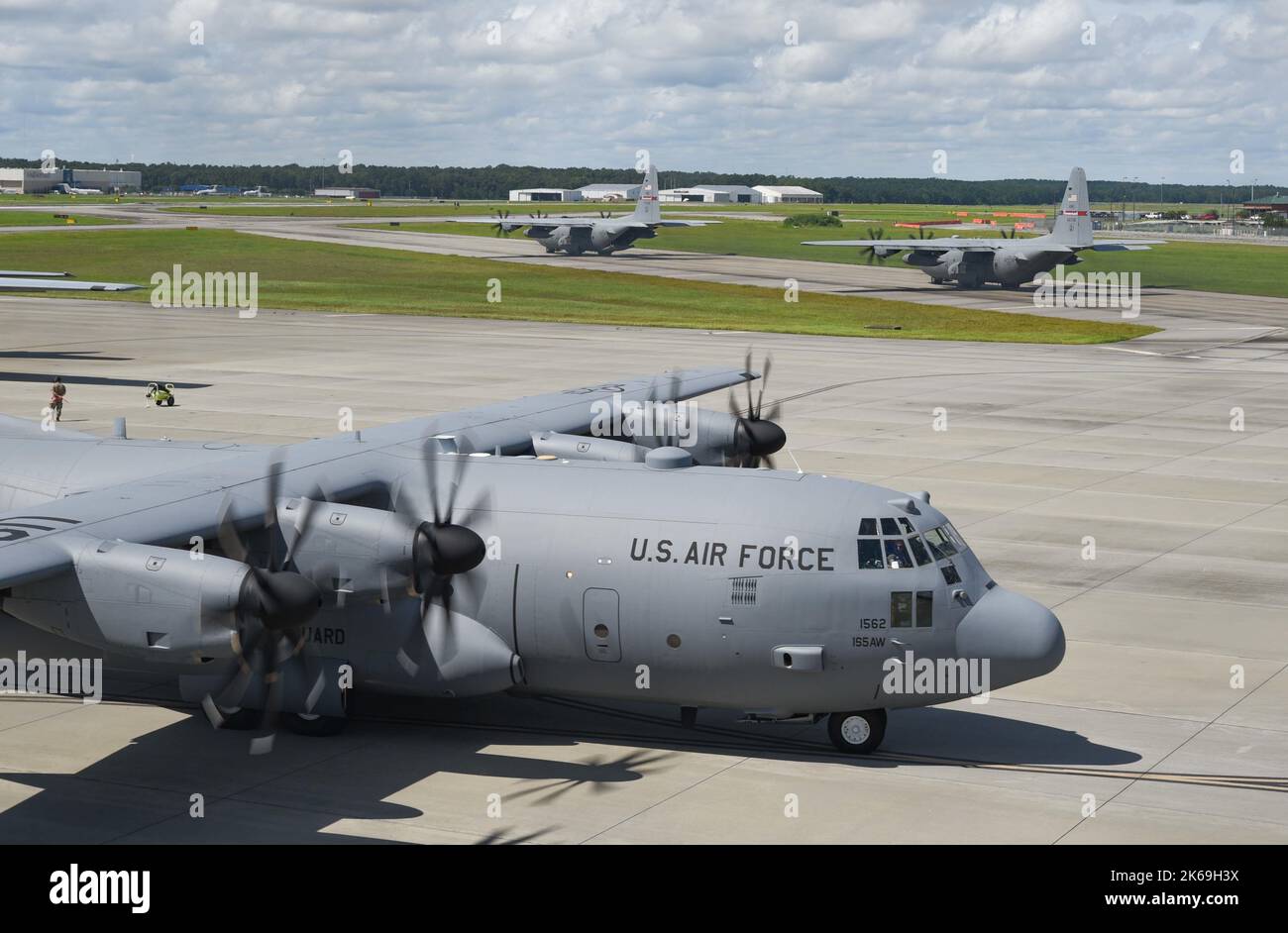 Three C-130 Hercules from the 165th Airlift Wing begin pre-flight engine checks on the flight line in Savannah, Georgia, September 11, 2022. The 165th AW recently completed the second phase of the modernization process that transitioned the C-130s from four-bladed propellers to eight-bladed propellers. The eight-bladed propellers will deliver more power and efficiency while reducing maintenance. (U.S. Air National Guard photo by Capt. Joseph Truschelli) Stock Photo