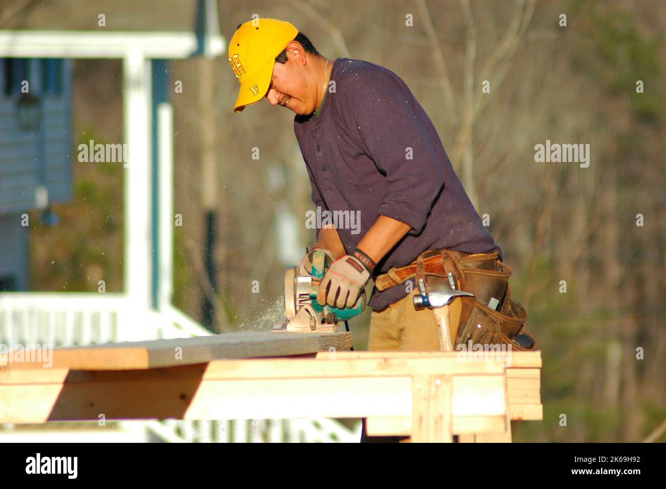 Hispanic Latin cutter on new home construction site where he cuts all ...