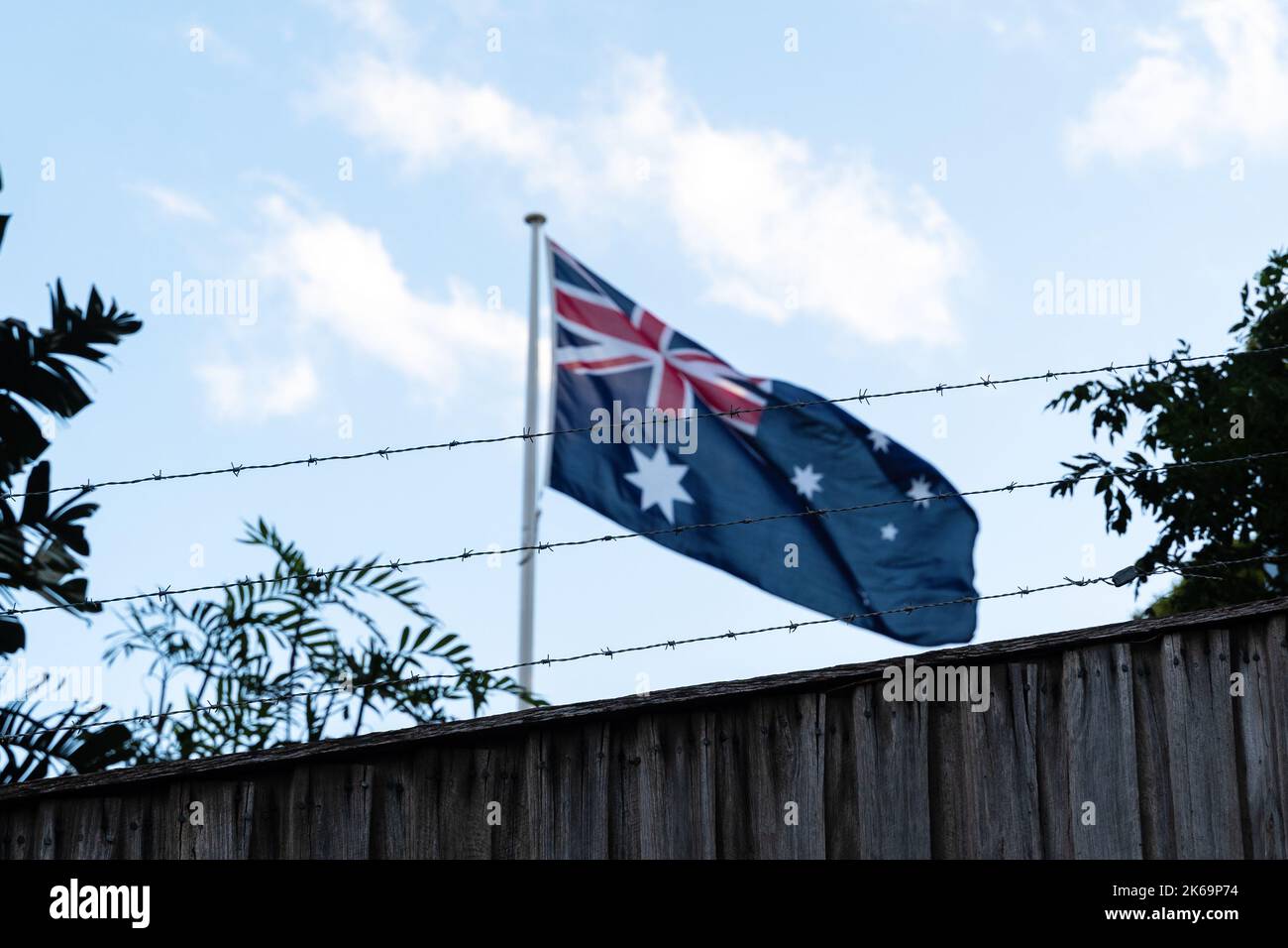 Australian Flag Behind Barb Wire Stock Photo Alamy