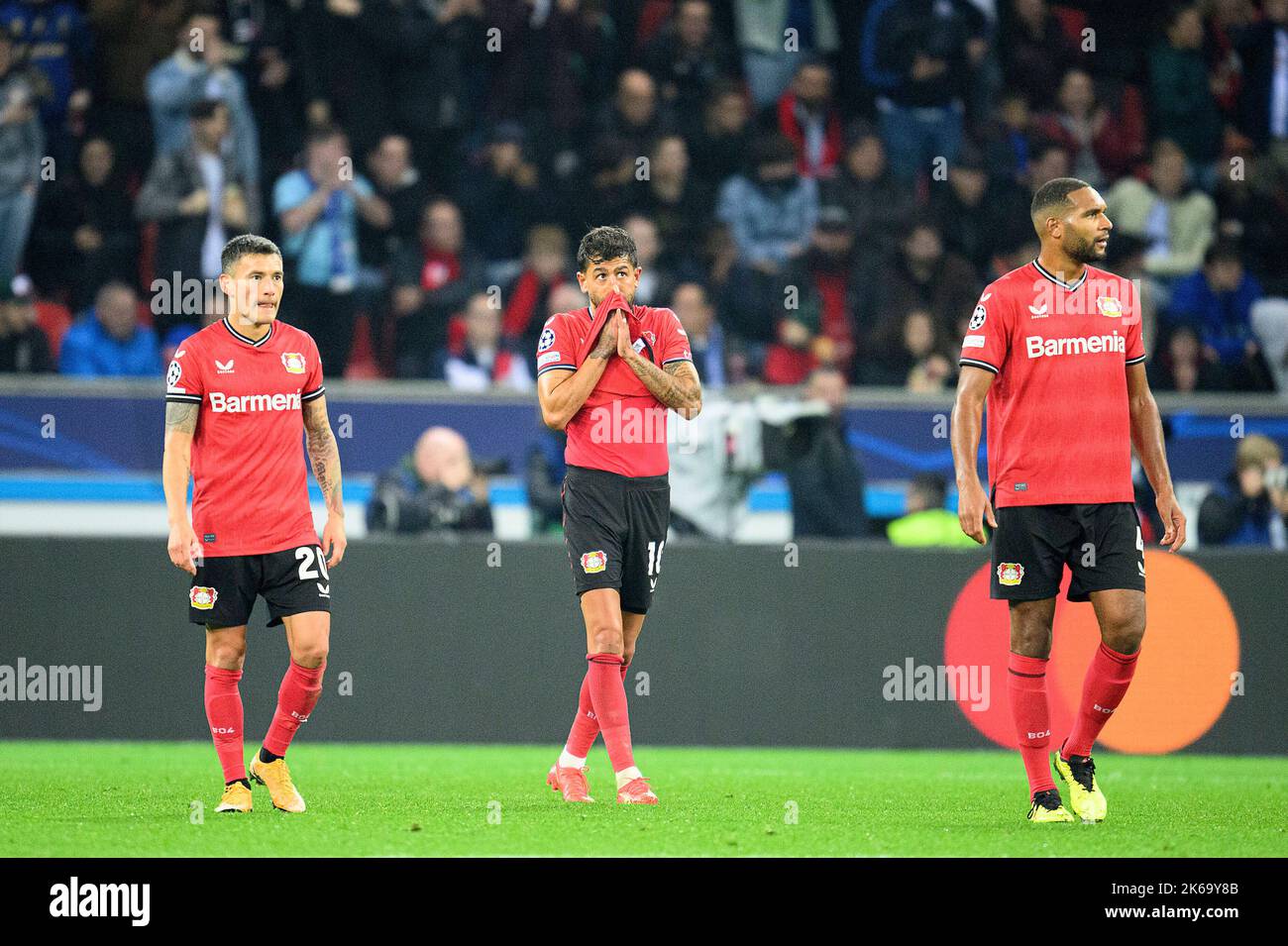 left to right Charles ARANGUIZ (LEV), Kerem DEMIRBAY (LEV), Jonathan TAH (LEV) disappointed Soccer Champions League, preliminary round 4th matchday, Bayer 04 Leverkusen (LEV) - FC Porto, on October 12th, 2022 in Leverkusen/ Germany. © Stock Photo