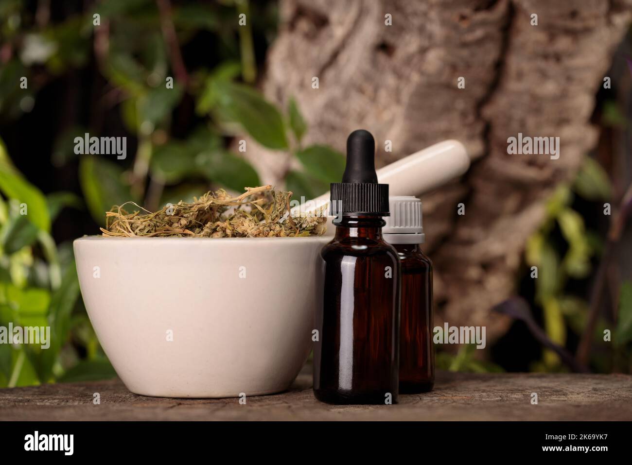Composition - madicin alternative. Medicinal marijuana extract, cbd. Dropper and mortar . Stock Photo