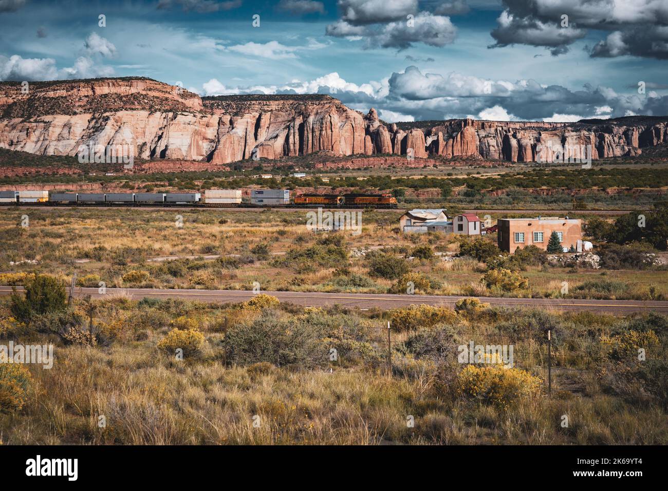 Freight train speeds through Gallup, New mexico Stock Photo Alamy