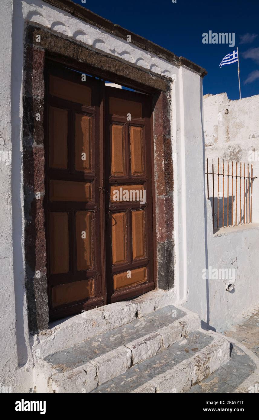 Old brown and orange painted wooden entrance doors, Fira village, Santorini, Greece. Stock Photo