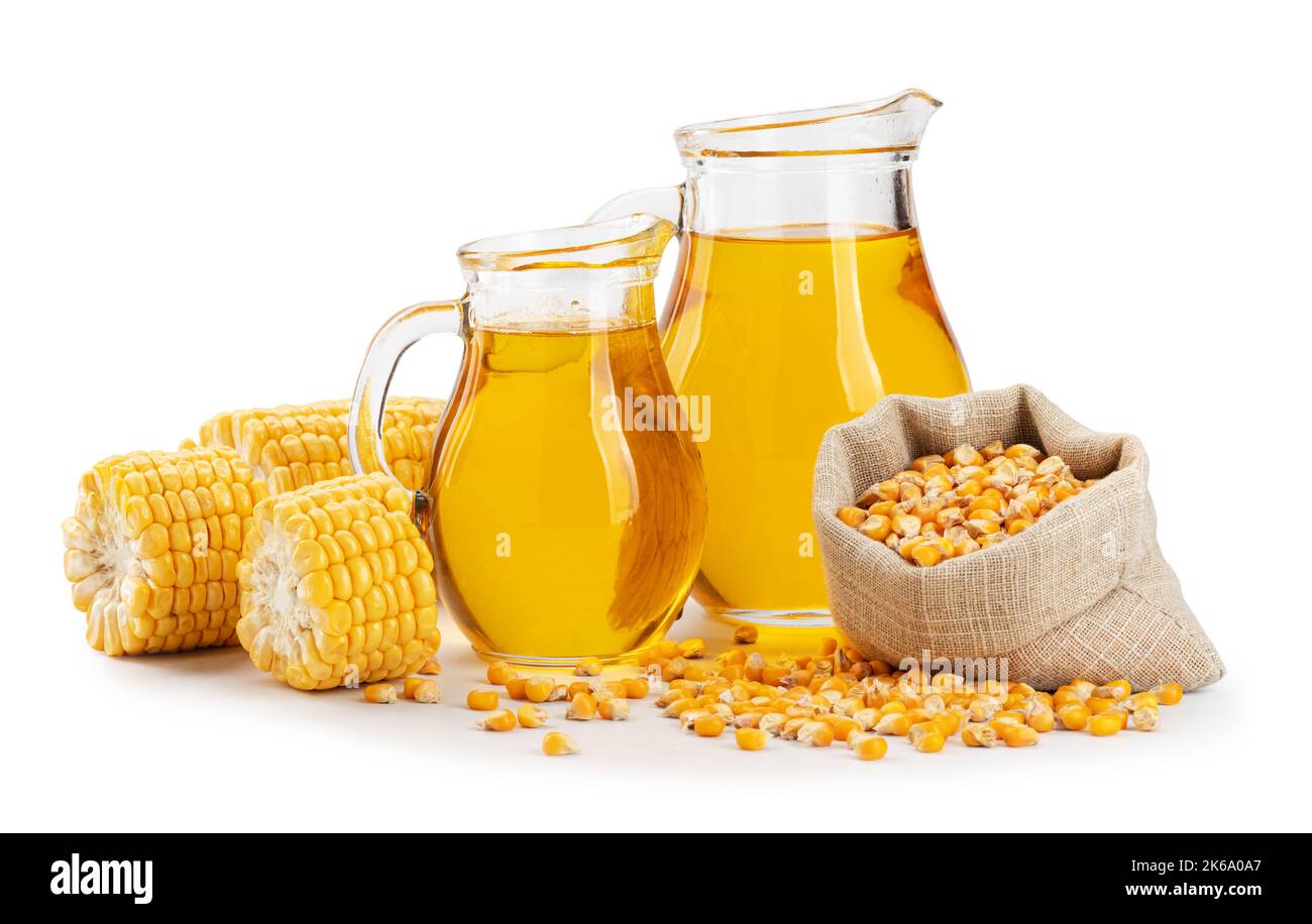 Corn oil in a bottle, corn seeds in a bag and broken corn cobs isolated