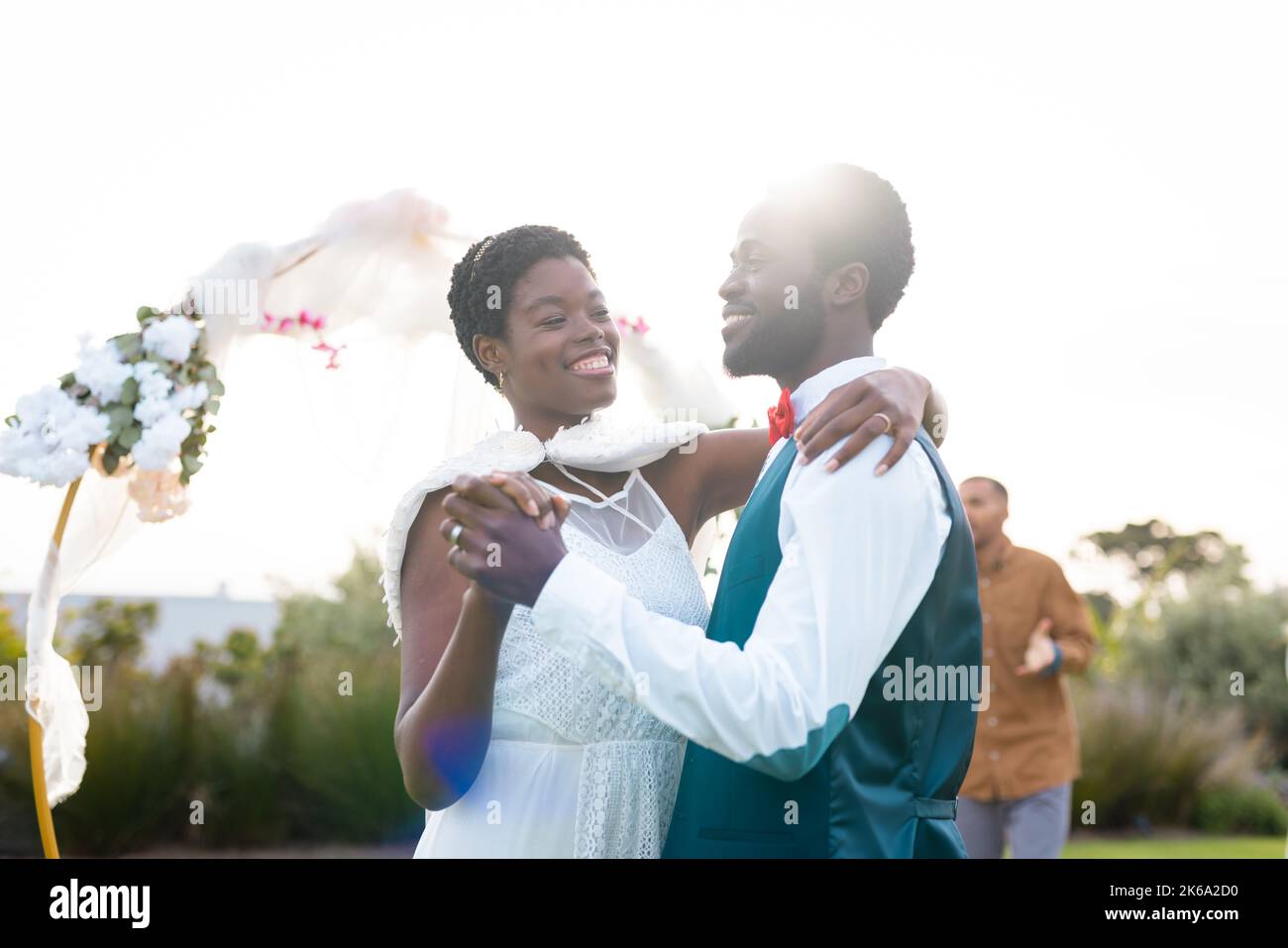 Happy african american couple holding hands during wedding Stock Photo ...