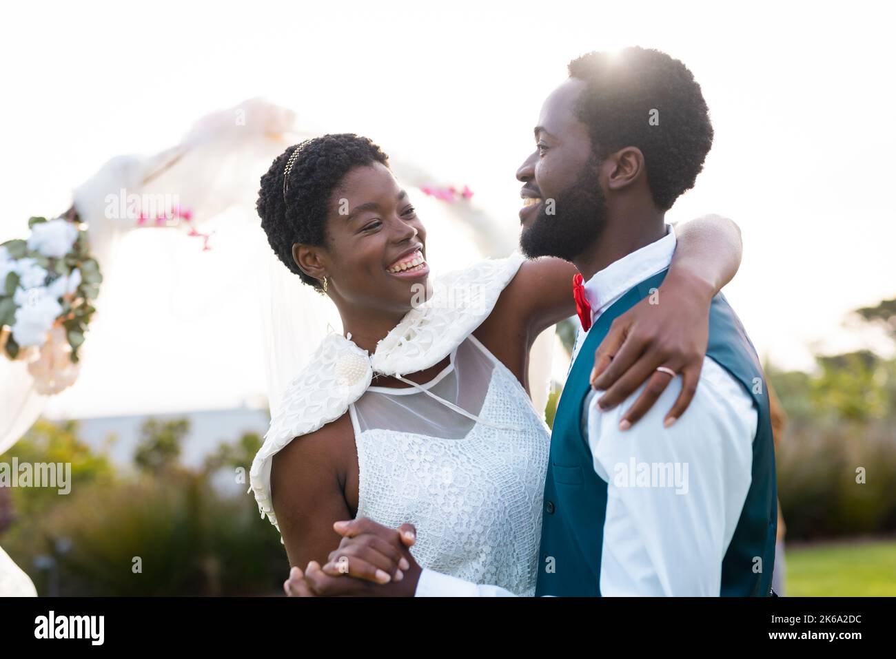 Happy african american couple holding hands during wedding Stock Photo ...