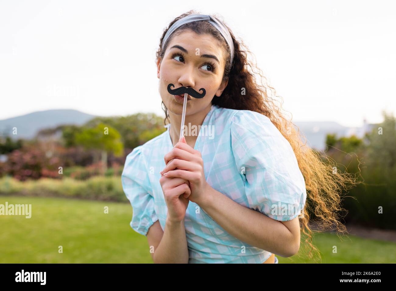 Attractive woman fake moustache hi-res stock photography and images - Alamy