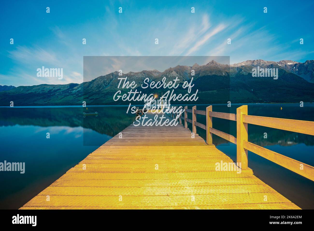 https://c8.alamy.com/comp/2K6A2EM/inspirational-success-quotes-on-the-mountain-sunset-background-the-secret-of-getting-ahead-is-getting-started-2K6A2EM.jpg