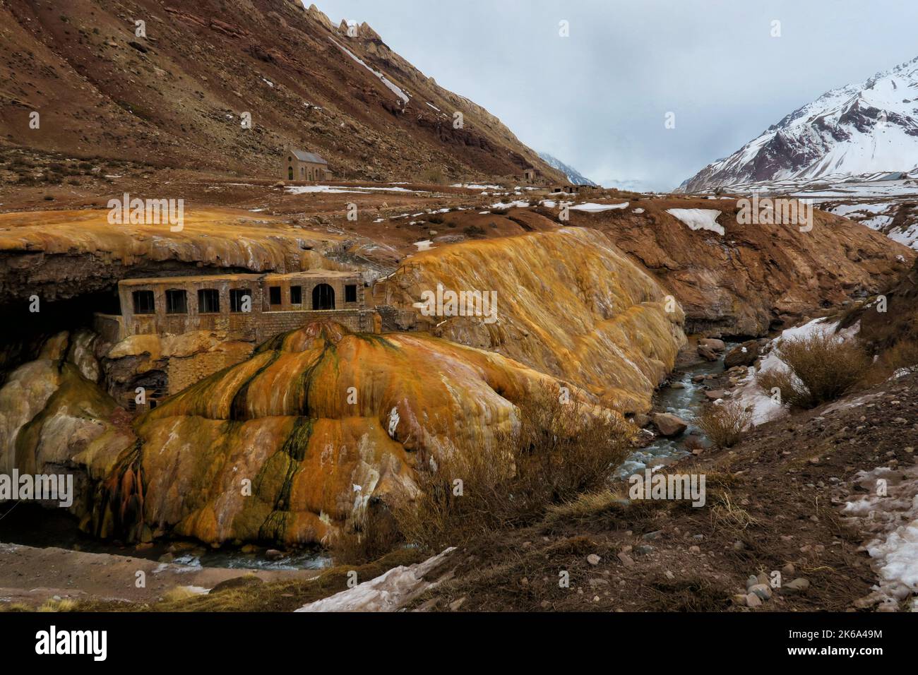 Old bridge of native Indians in high mountains with spring of water with sulfur Stock Photo