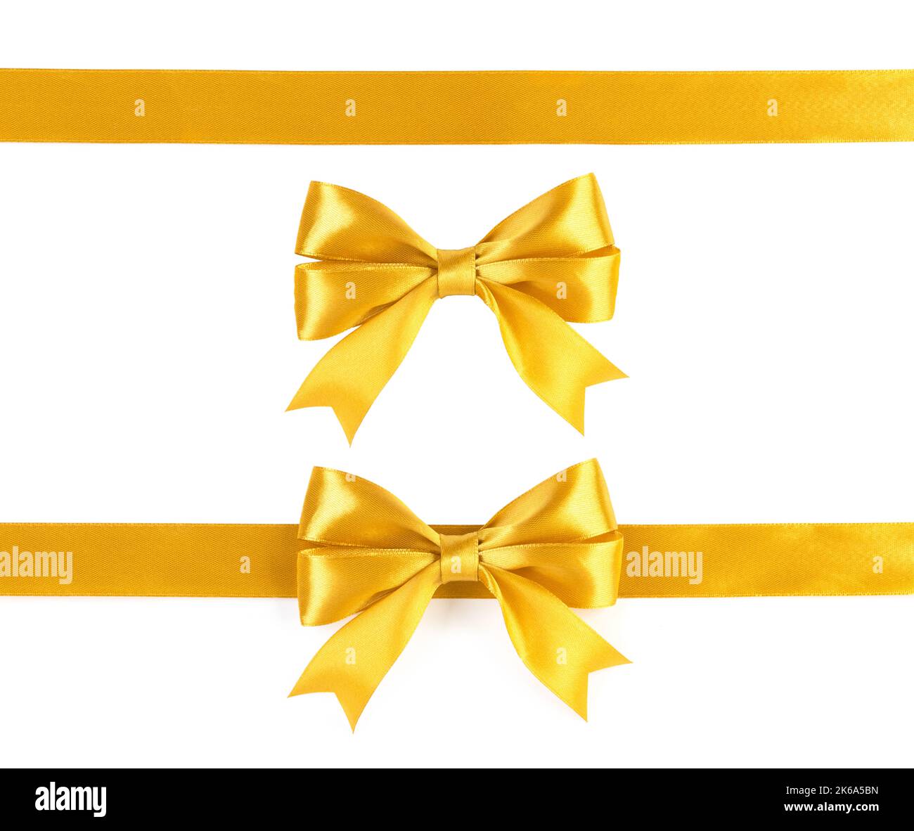 Gold ribbons with bow isolated on white background Stock Photo - Alamy
