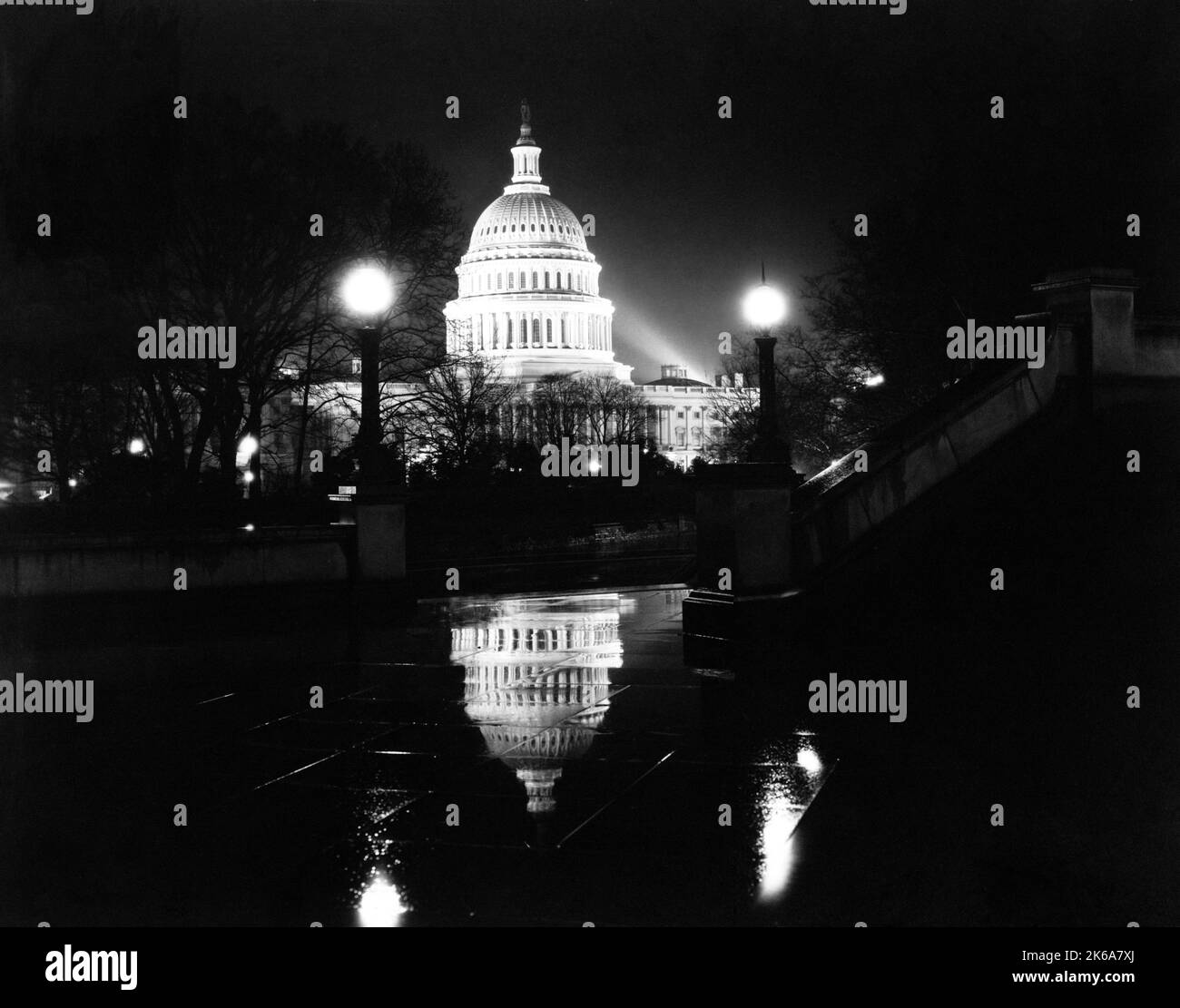 Front of the U.S. Capitol in Washington D.C. on a rainy night, circa 1923. Stock Photo