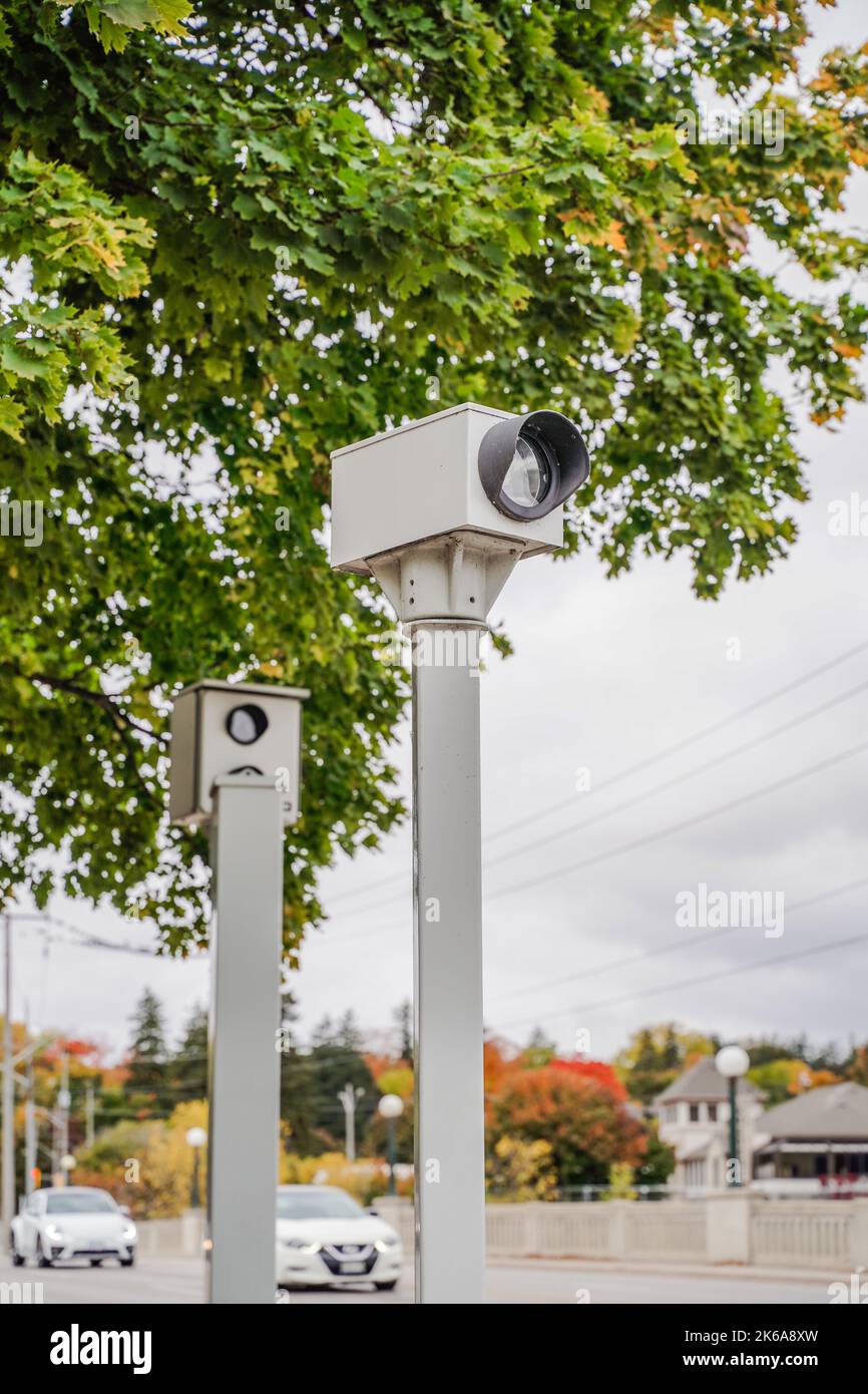 red light camera catching cars running thru red traffic light Stock