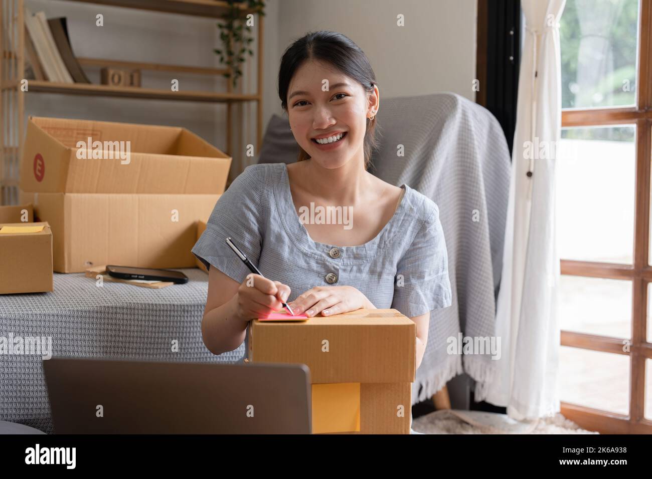 Asian small business owner working at home office. Business retail market and online sell marketing delivery, SME e-commerce concept Stock Photo