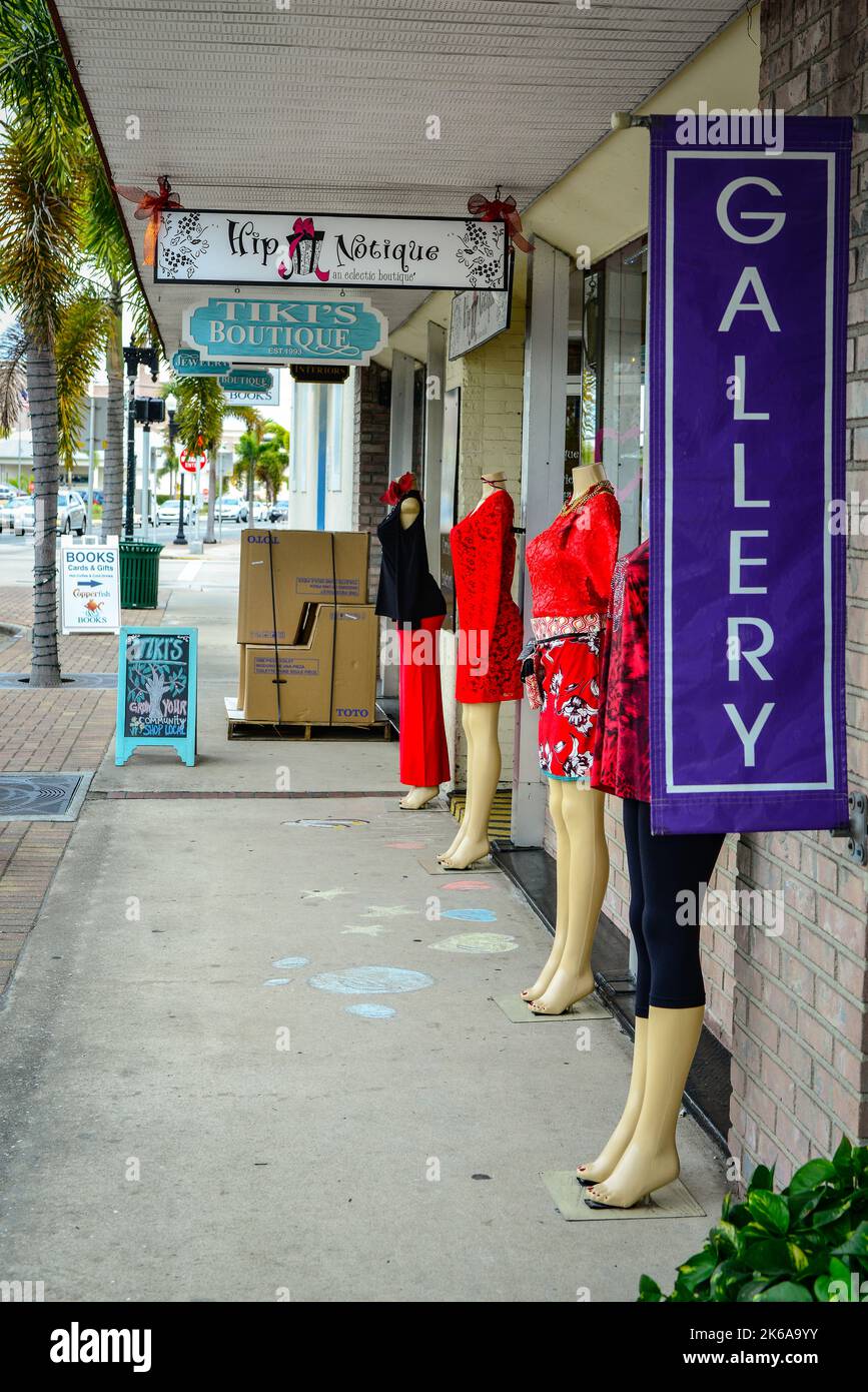 Storefronts and mannequins line up along the sidewalk displaying fashions for snowbirds in Punta Gorda, Florida on the Southwest coast of Florida Stock Photo