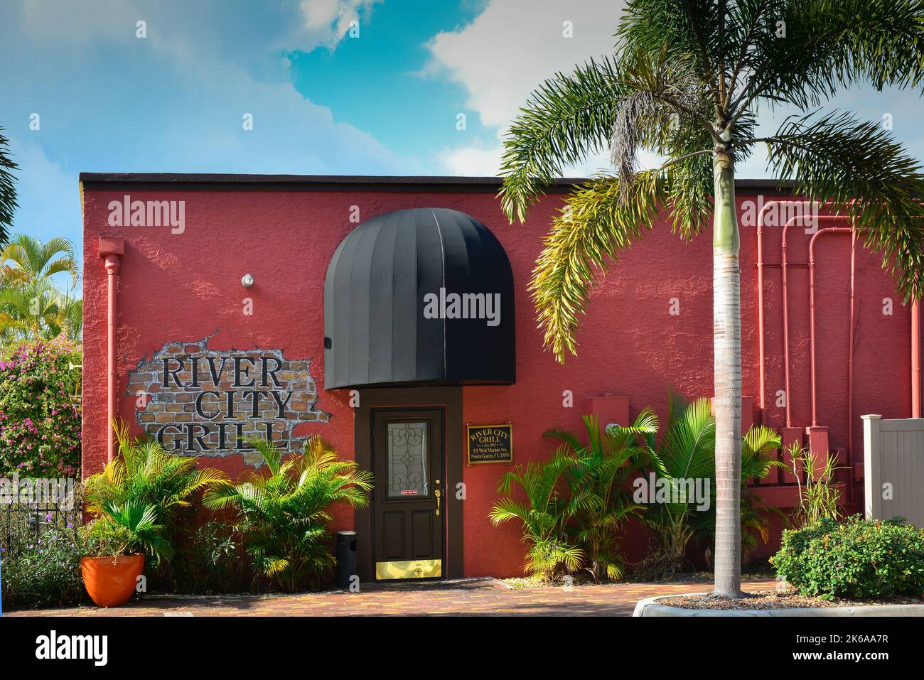The River City Grill, a popular and trendy restaurant with tropical vibe in downtown Punta Gorda, FL, in a vertical format with copy space Stock Photo