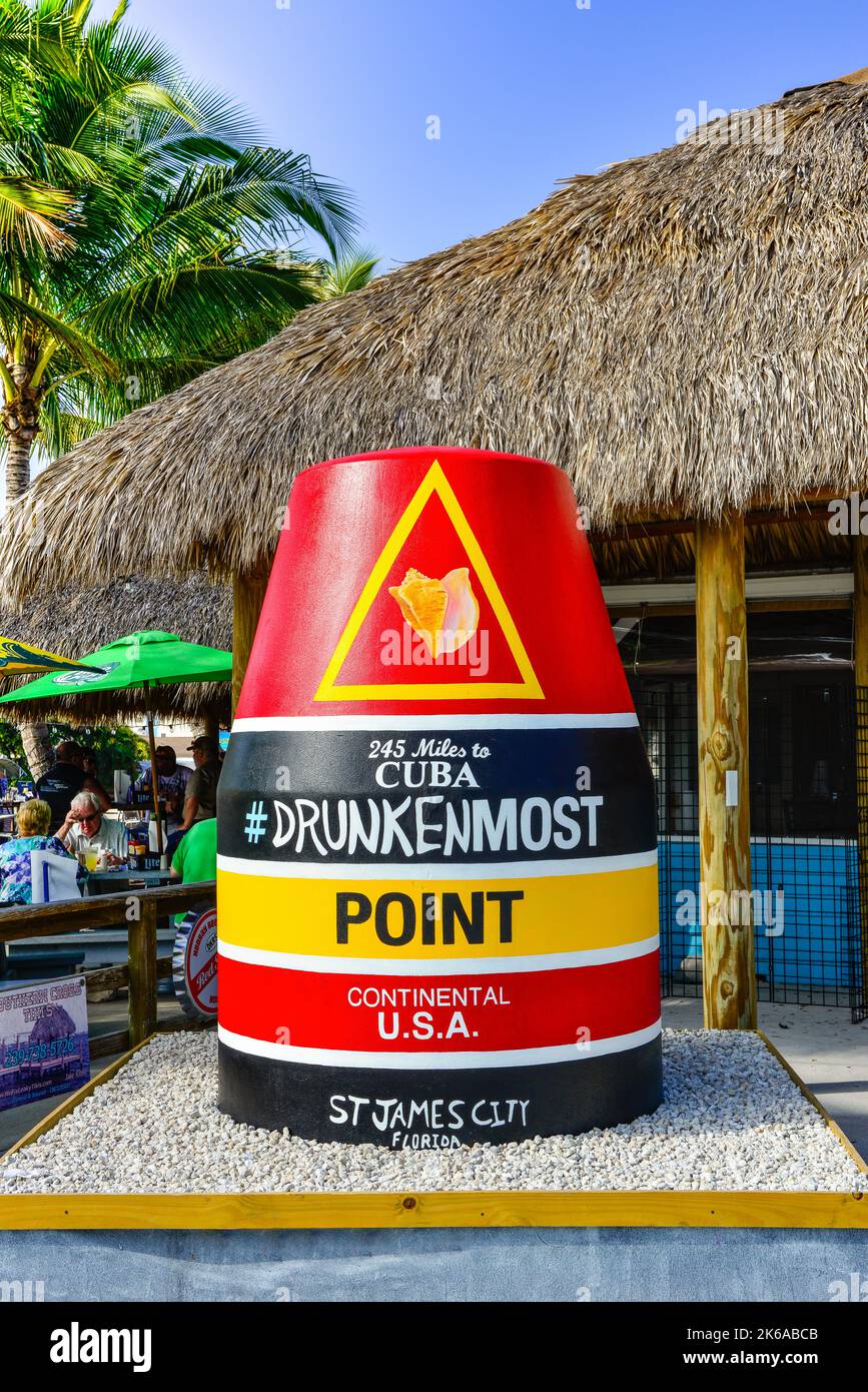 Thatched roofs of Phuzzy's Boat Shack restaurant advertises the culture with buoy in St. James City located on Pine Island, FL before 'Hurricane Ian' Stock Photo
