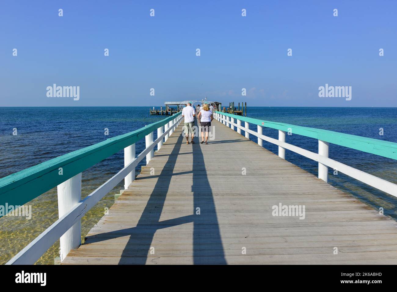 A couple enjoy the Bokeelia Fishing Pier located on the northern tip of Pine Island, Florida on the Charlotte Harbor before Hurricane Ian Stock Photo