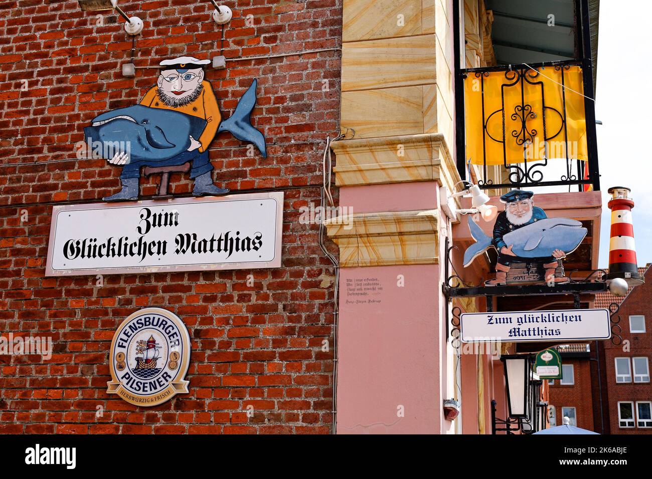 Signs of Seafood Restaurant on red brick wall, Wyk, Fohr, North Frisian Islands, Germany Stock Photo