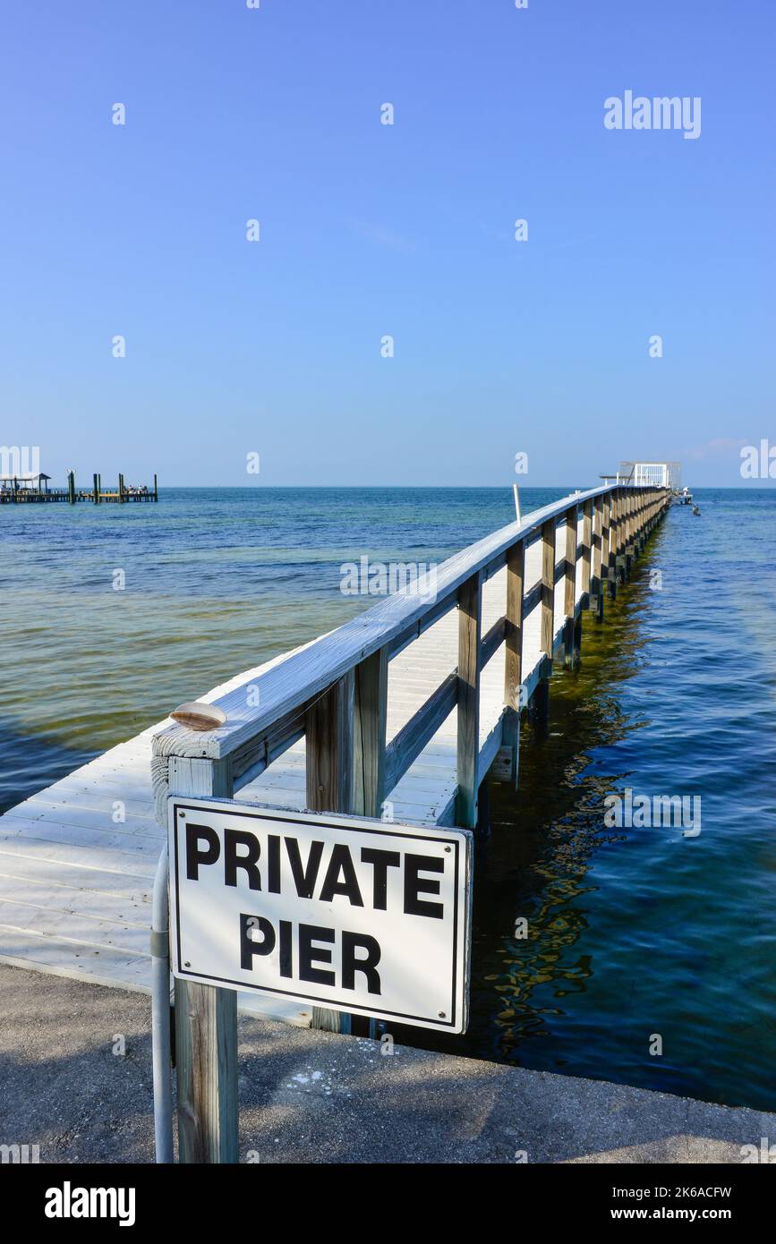 Sign for one of many private piers jutting out into the Charlotte Harbor on Pine Island in Lee County, Florida before Hurricane Ian devastated area Stock Photo