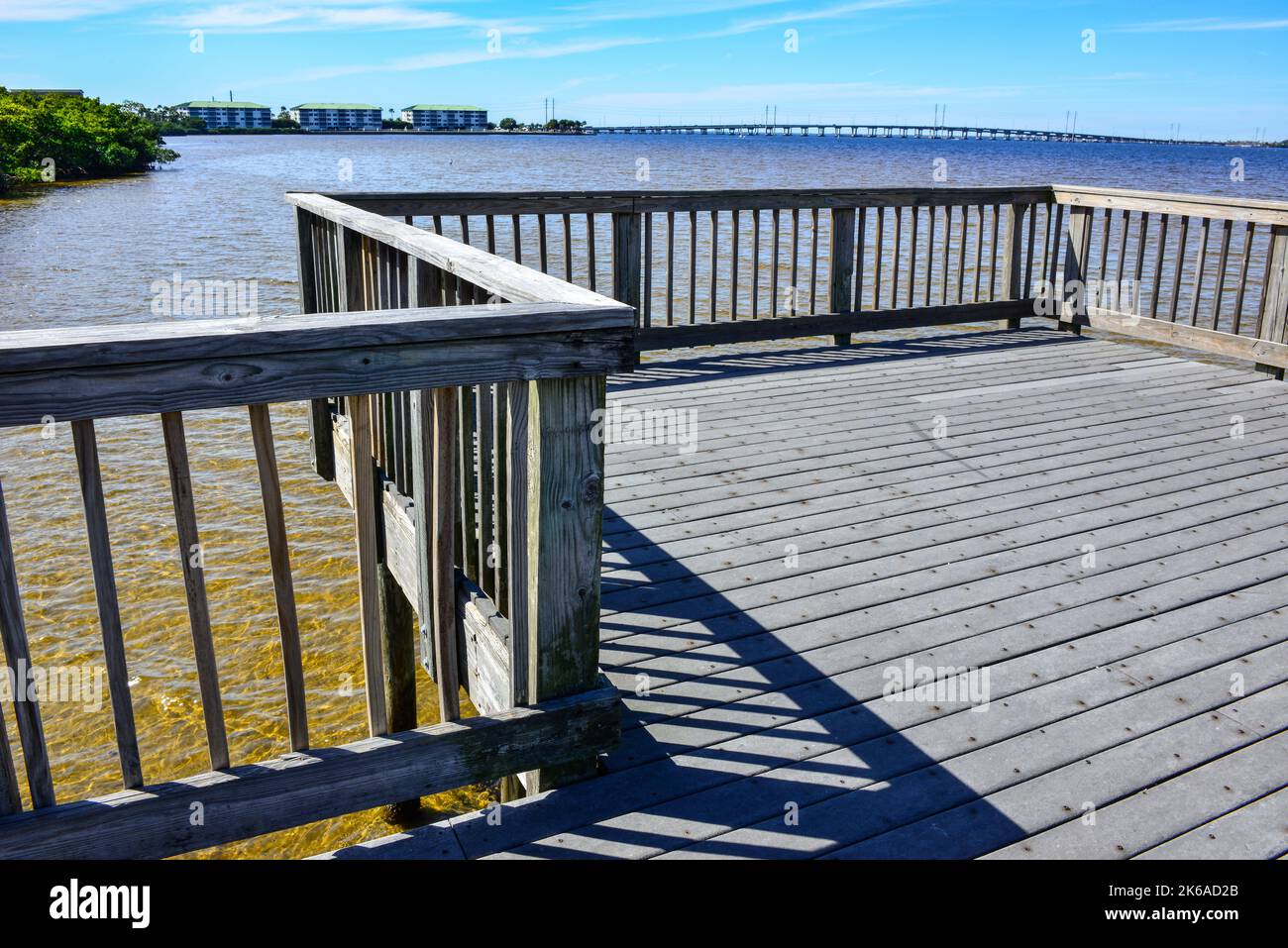 Distant View of the Gilchrist Bridge crossing the Peace River between Port Charlotte and Punta Gorda, Florida from a recreational path with observatio Stock Photo