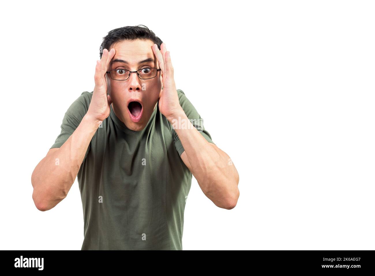 Shocked male nerd in glasses looking at camera Stock Photo
