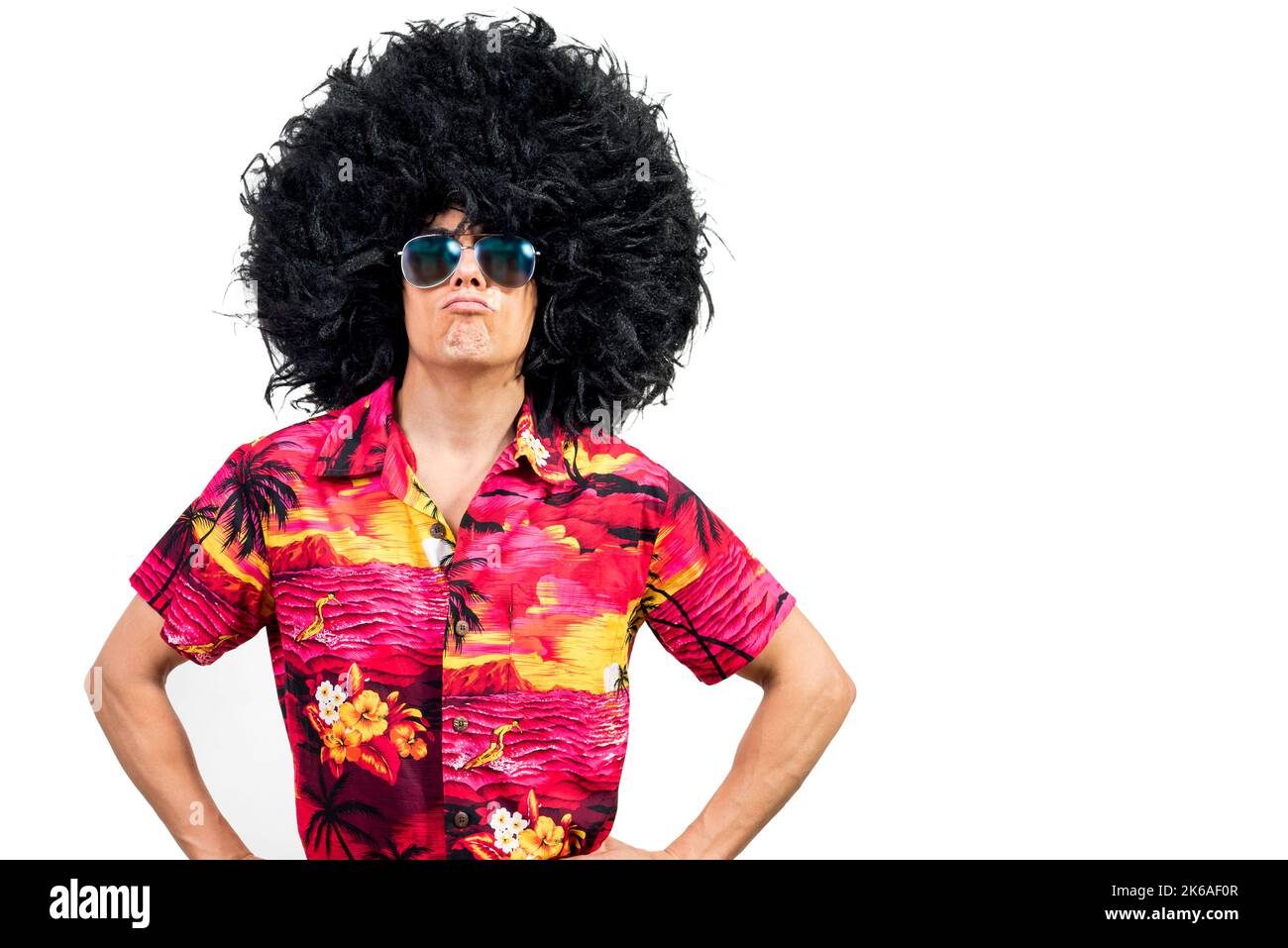 Confident man in Afro wig pouting lips Stock Photo