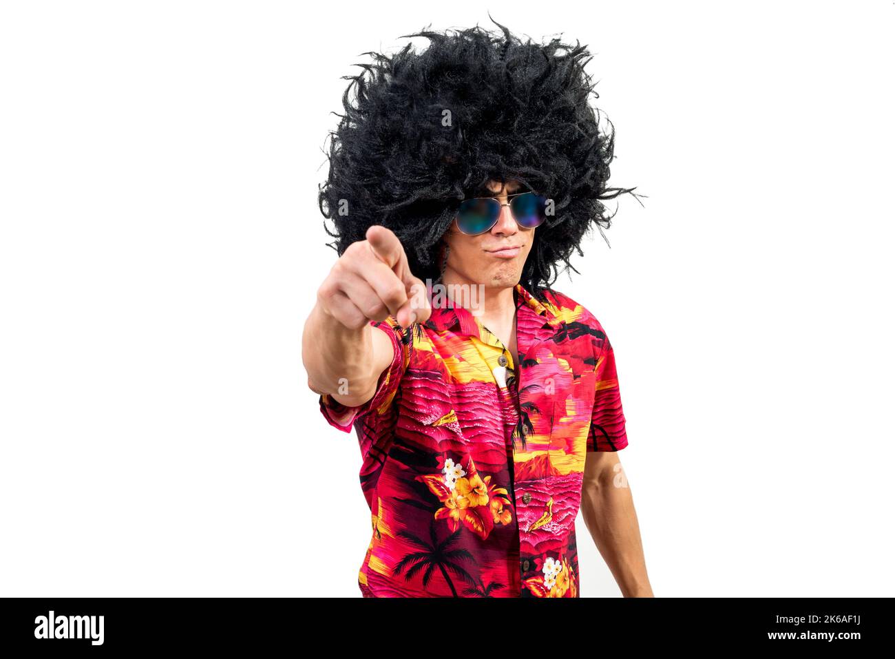 Self assured man in Afro wig pointing at camera Stock Photo