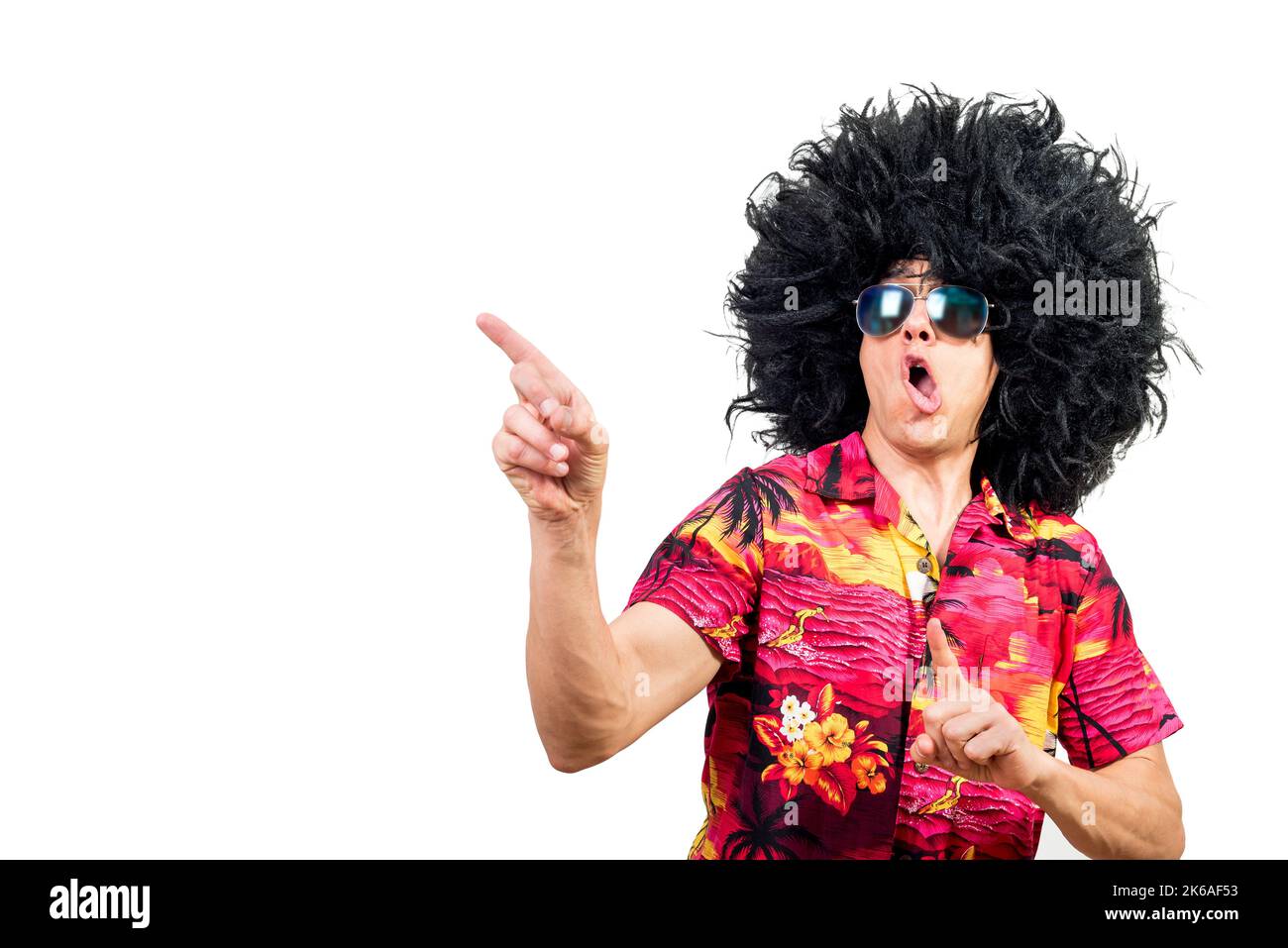 Funny male in Afro wig pointing away Stock Photo