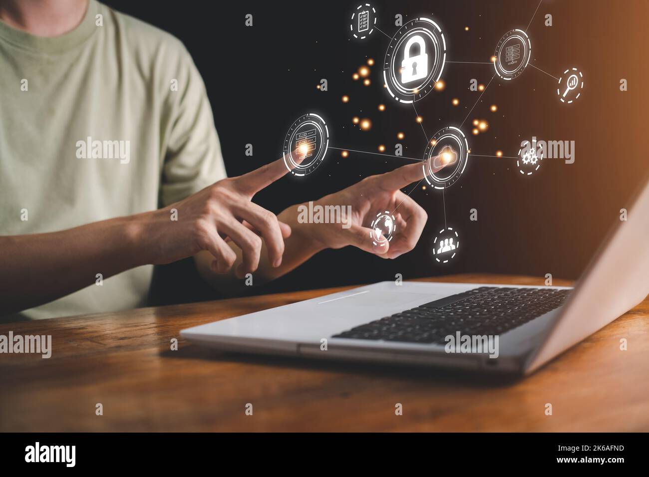 Cloud computing technology concept. Man is touch hologram and using notebook (Laptop). Internet storage network system. Big data and business. Stock Photo